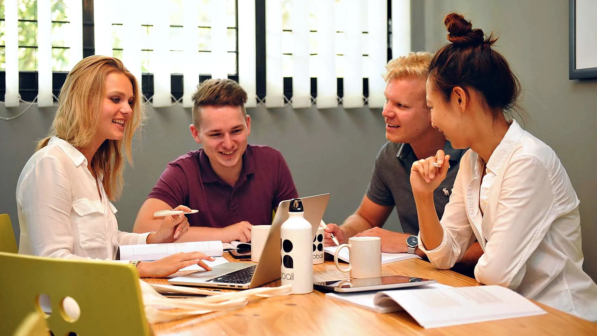 Business students working together in a GoBali class at Udayana University, Bali