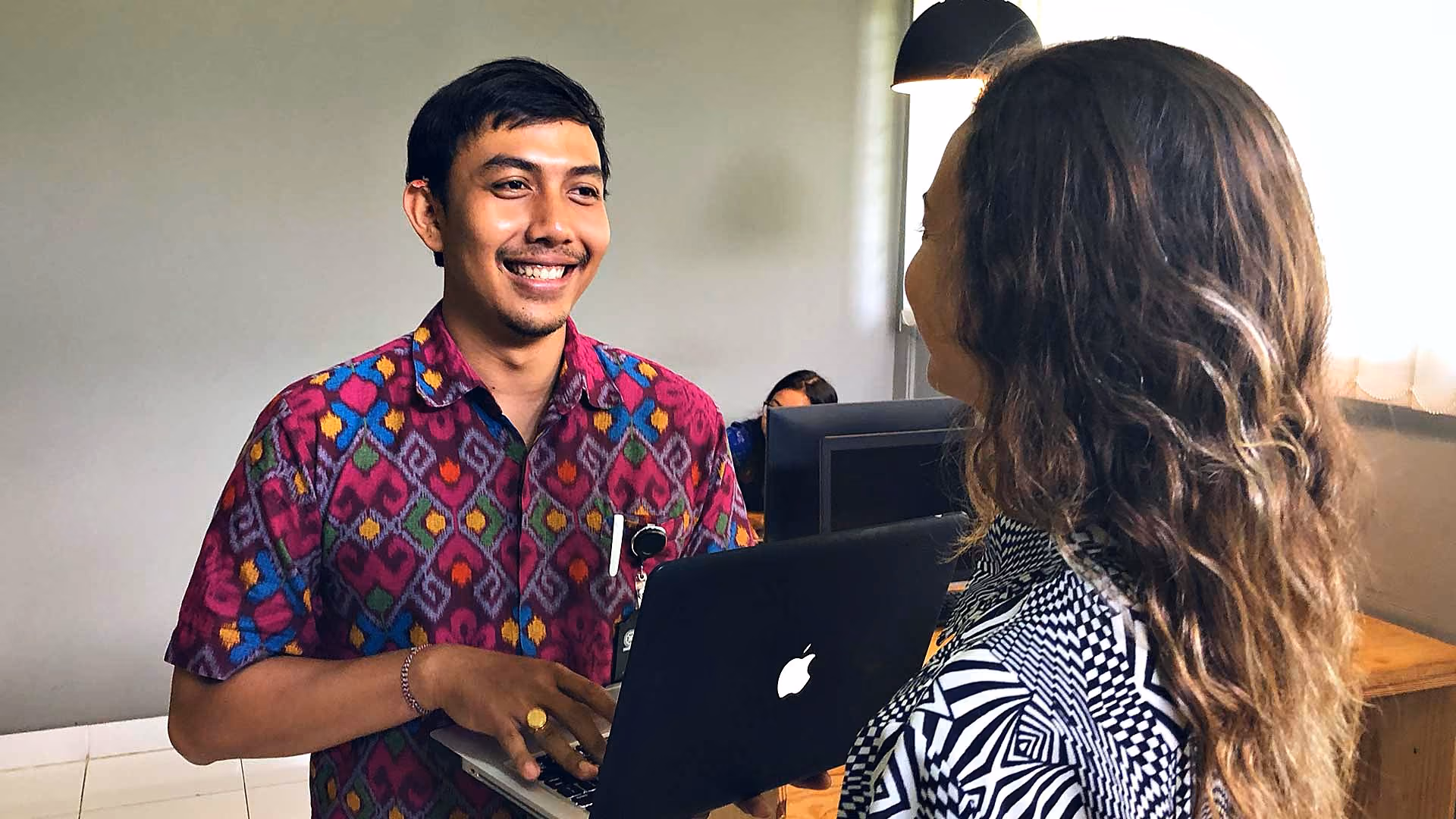 GoBali team member helping a student in the GoBali office in Bali