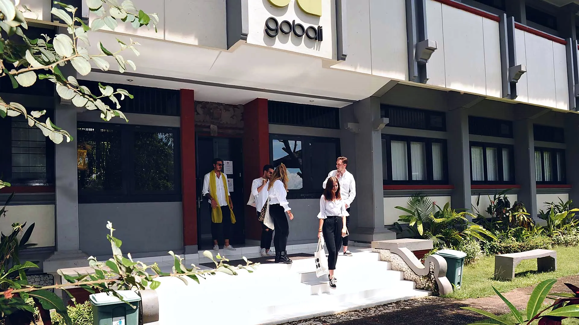 Students in front of the GoBali building on the campus of Udayana University, Bali